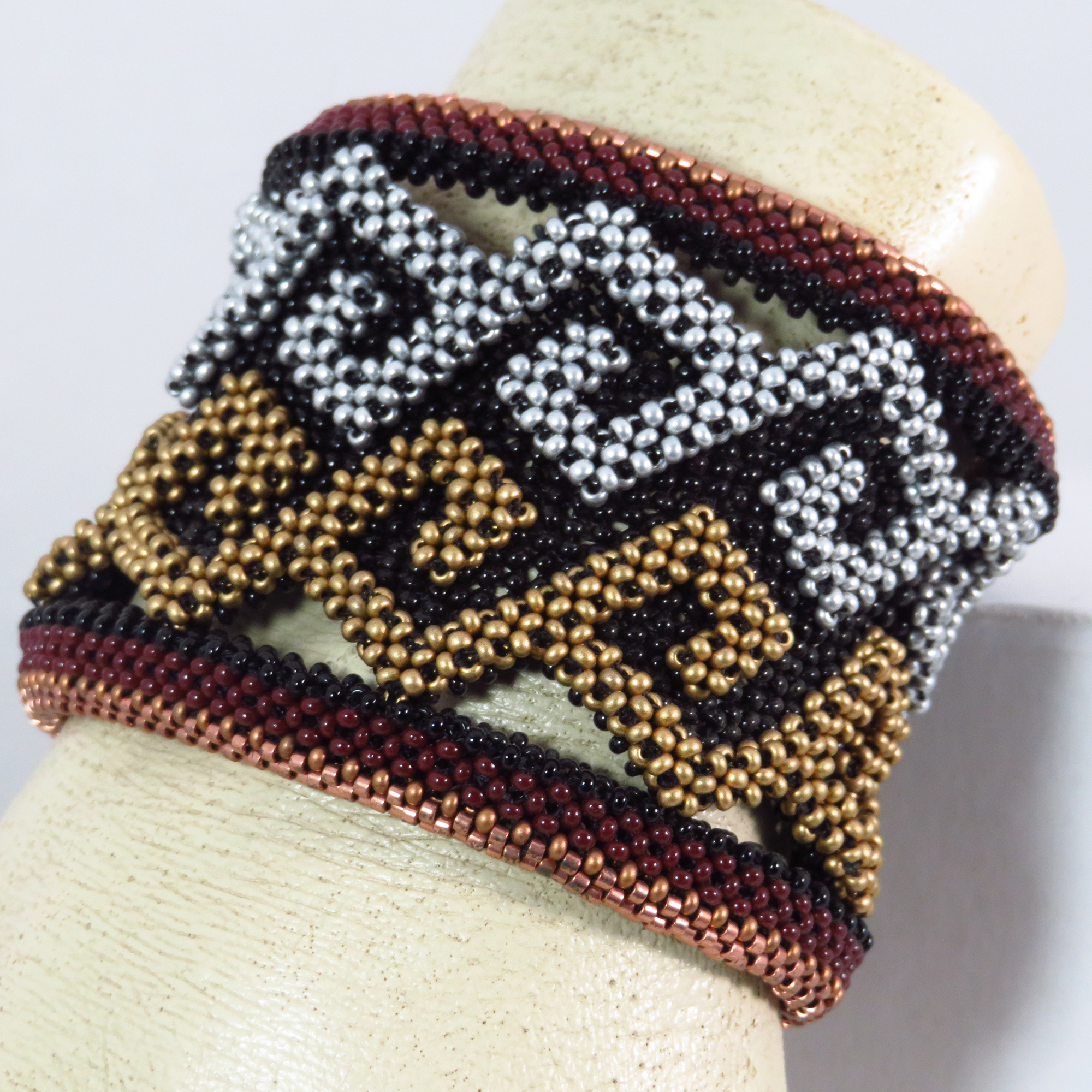 Beaded bracelet geometric spirals cuff by Bonnie Van Hall