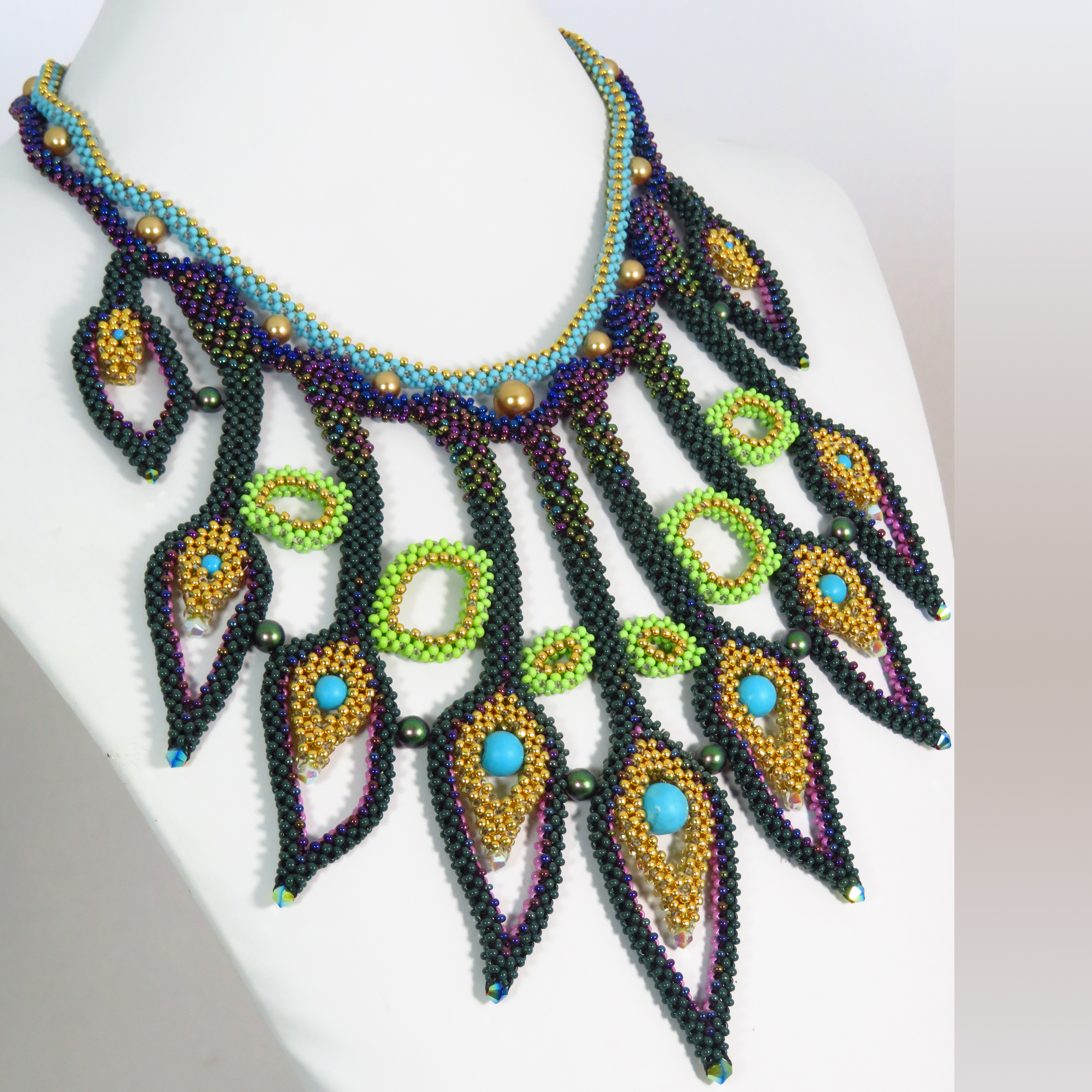 Beaded peacock feather necklace by Bonnie Van Hall